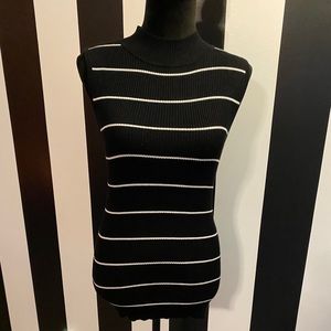 Sleeveless mock neck sweater